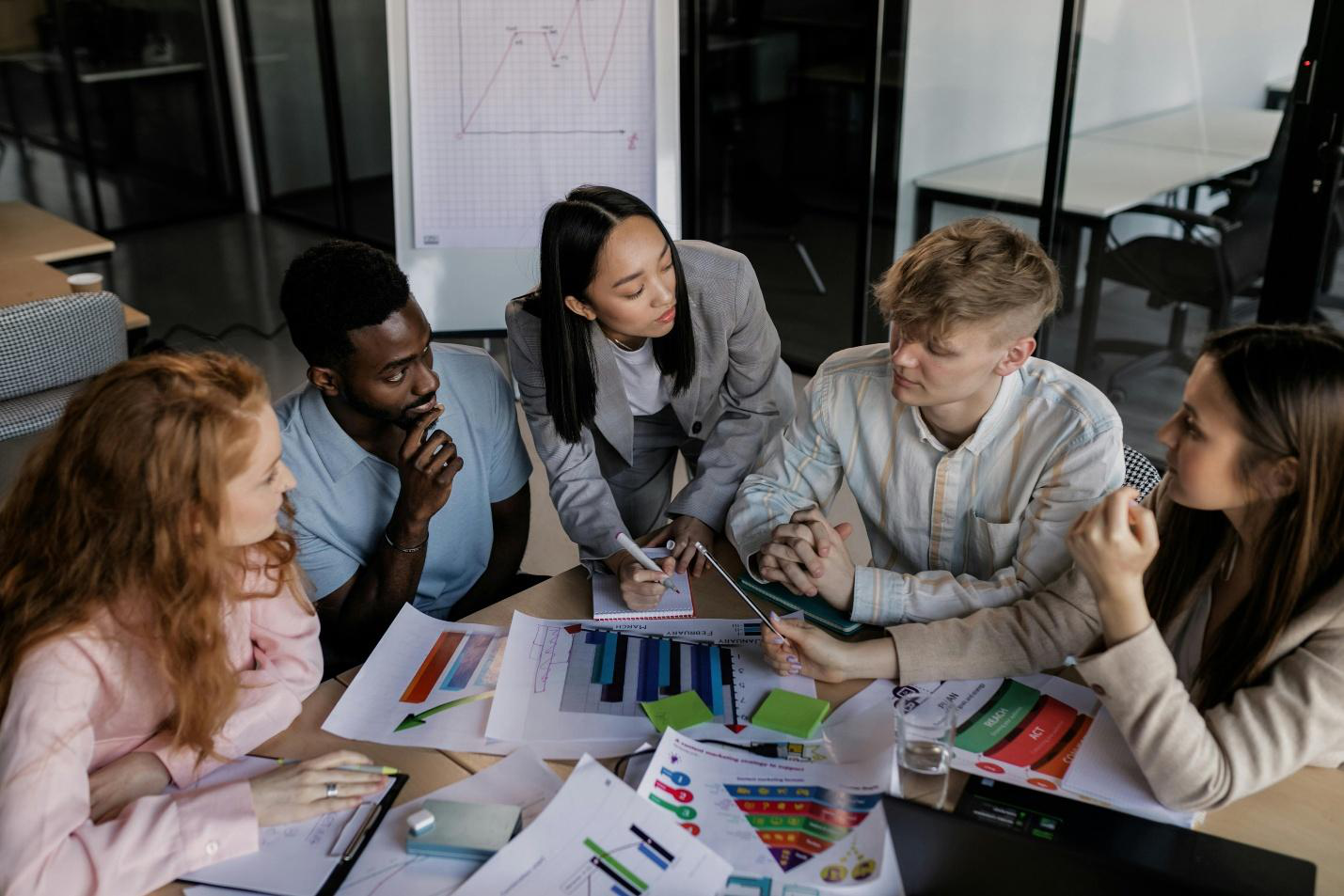 A group of people in a meeting
